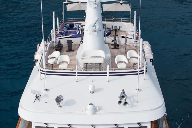 Synthesis 66 Yacht Photos Pics Luxurious 1982 Feadship yacht deck with seating and ocean backdrop.