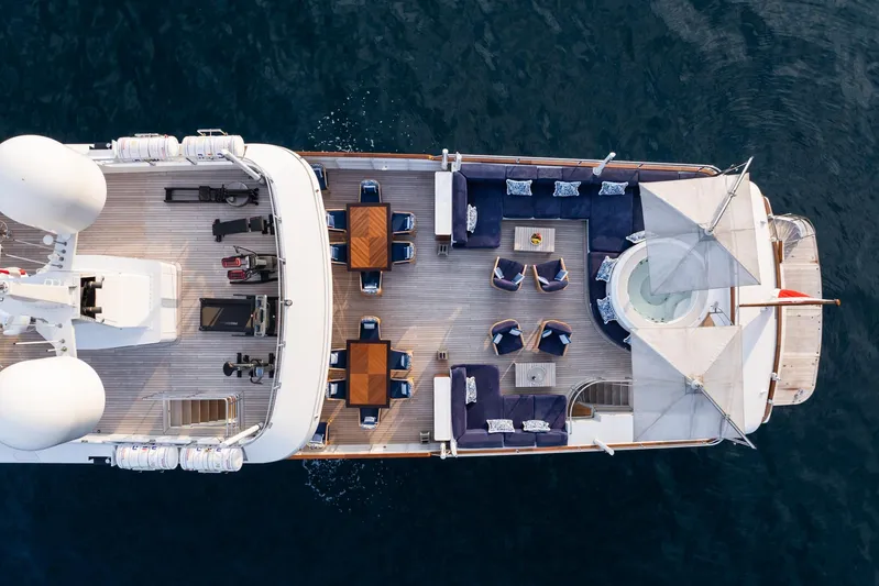 Synthesis 66 Yacht Photos Pics Aerial view of 1982 Feadship yacht deck with seating and tables.