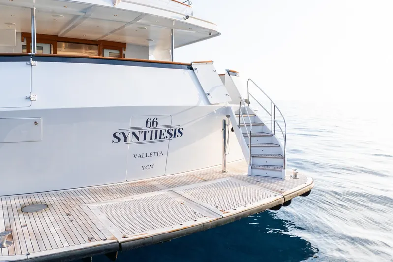 Synthesis 66 Yacht Photos Pics Luxury yacht "Synthesis" by Feadship, 1982, docked on calm waters, rear view.