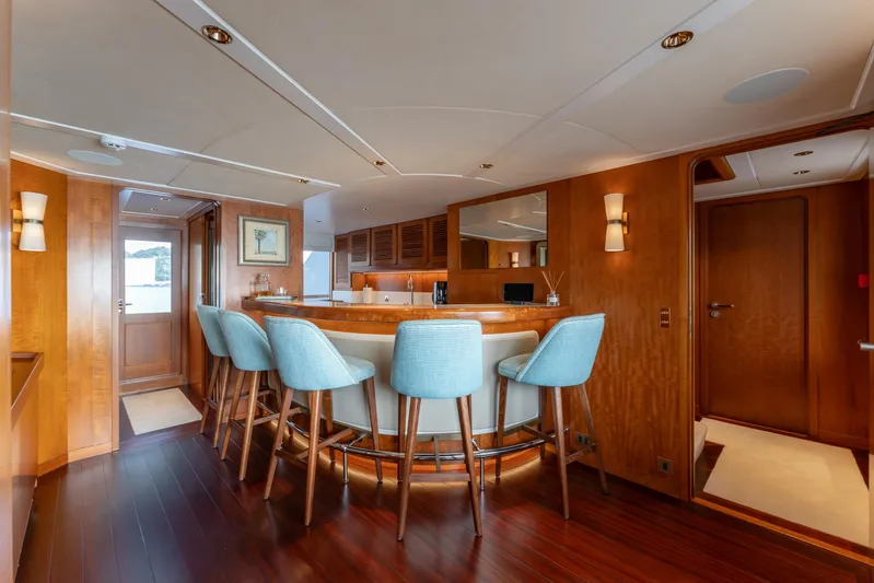 Synthesis 66 Yacht Photos Pics Luxurious 1982 Feadship yacht interior with elegant bar and stylish seating.