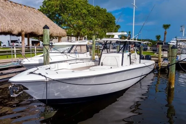  Yacht Photos Pics 2020 Contender 44 ST boat docked at marina under clear blue sky.