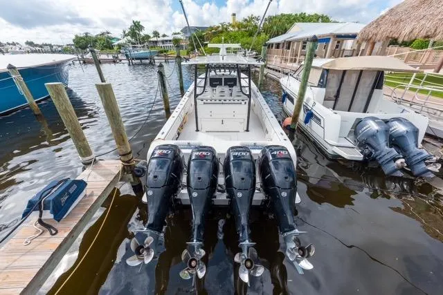  Yacht Photos Pics 2020 Contender 44 ST boat docked with four powerful outboard engines.