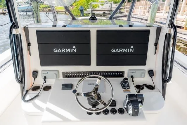  Yacht Photos Pics 2020 Contender 44 ST boat helm with dual Garmin displays and Mercury controls.