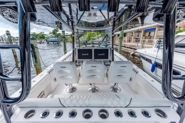  Yacht Photos Pics 2020 Contender 44 ST boat interior with helm seats and navigation screens.