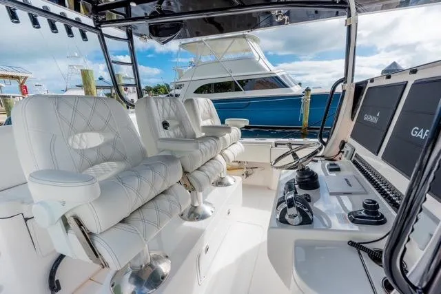  Yacht Photos Pics 2020 Contender 44 ST boat interior with luxurious seating and advanced navigation systems.