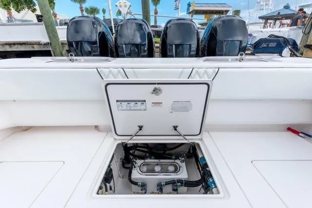  Yacht Photos Pics 2020 Contender 44 ST boat with open hatch and four powerful outboard engines.