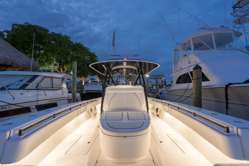  Yacht Photos Pics 2020 Contender 44 ST boat docked at marina during evening.