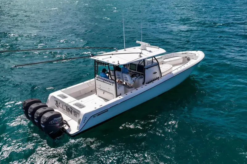  Yacht Photos Pics 2020 Contender 44 ST boat on open water, featuring triple outboard engines.