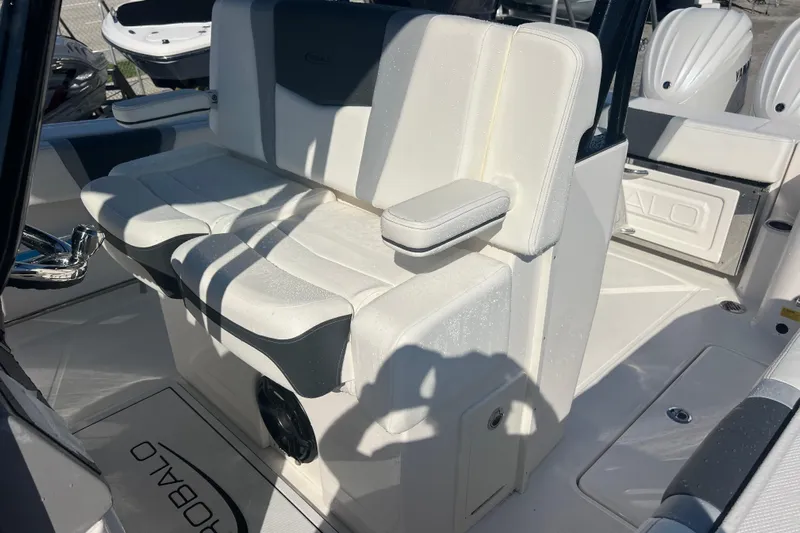  Yacht Photos Pics 2025 Robalo R270 Center Console boat interior with cushioned seating and armrest.