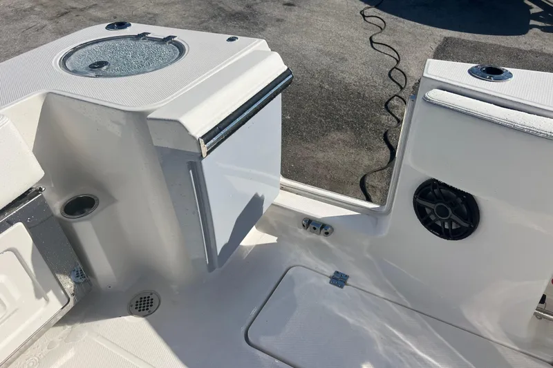  Yacht Photos Pics 2025 Robalo R270 Center Console boat interior with speaker and storage compartments.