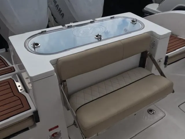  Yacht Photos Pics 2017 Sea Fox 288 Commander boat with cushioned seating and storage compartment.