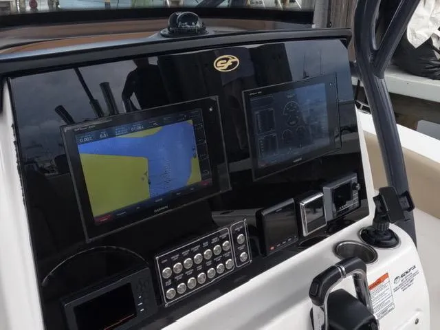  Yacht Photos Pics 2017 Sea Fox 288 Commander dashboard with navigation screens and controls.