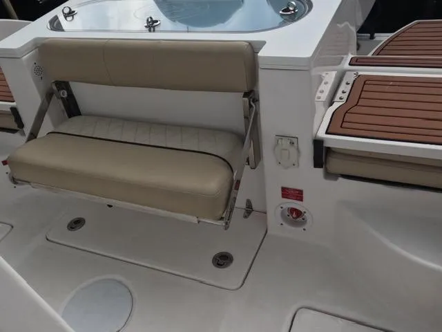  Yacht Photos Pics 2017 Sea Fox 288 Commander boat interior with cushioned seating and teak accents.