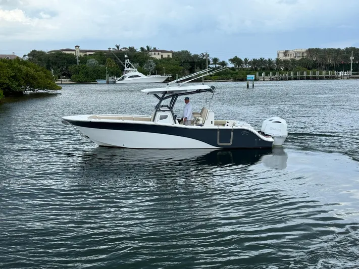  Yacht Photos Pics 2017 Sea Fox 288 Commander boat cruising on a calm waterway.
