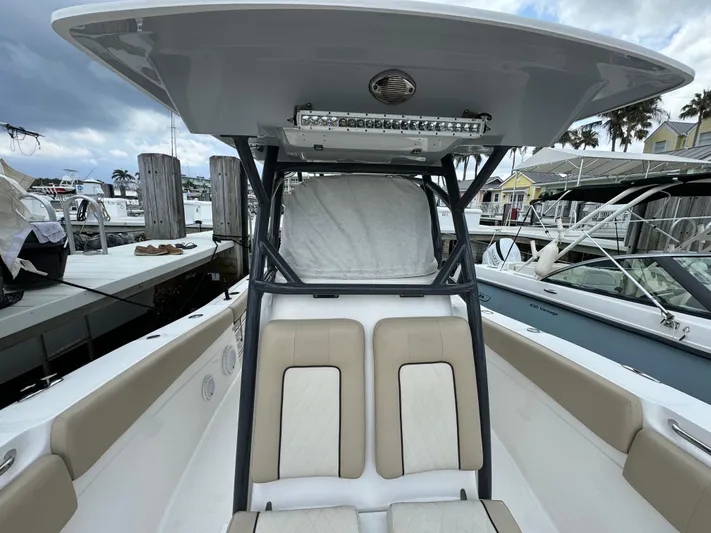  Yacht Photos Pics 2017 Sea Fox 288 Commander boat interior with seating and T-top at marina.