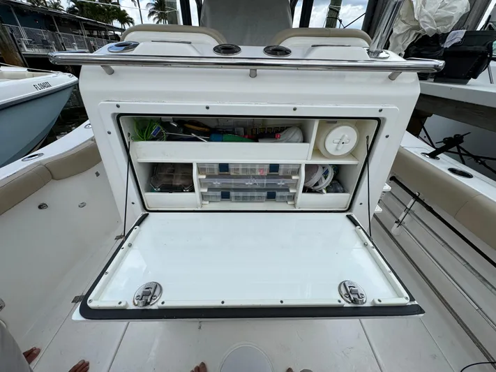  Yacht Photos Pics 2017 Sea Fox 288 Commander boat storage compartment with organized fishing gear.