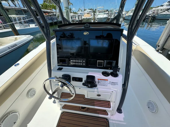  Yacht Photos Pics 2017 Sea Fox 288 Commander boat dashboard with steering wheel and navigation controls.