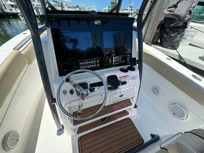  Yacht Photos Pics 2017 Sea Fox 288 Commander boat cockpit with steering wheel and control panel.