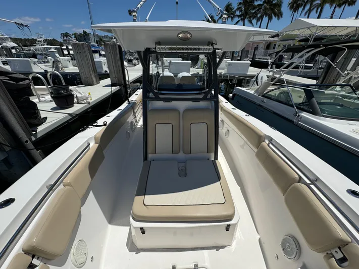  Yacht Photos Pics 2017 Sea Fox 288 Commander boat docked, featuring spacious seating and sleek design.