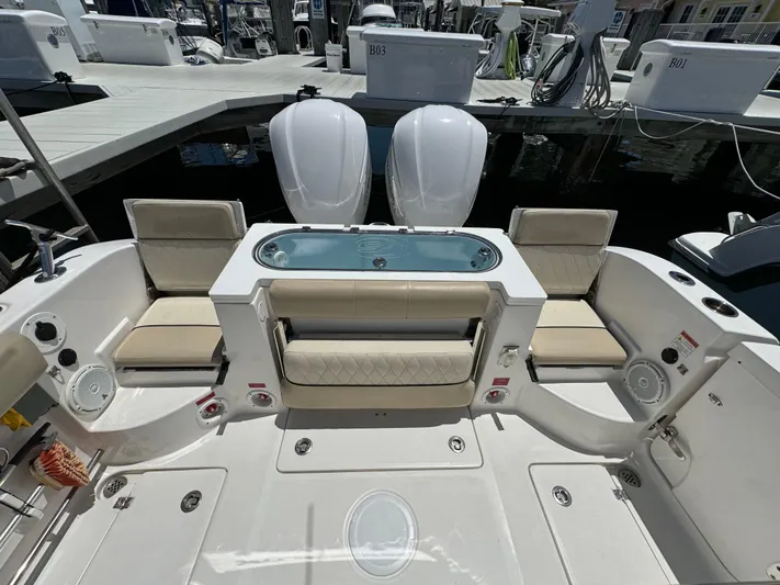  Yacht Photos Pics 2017 Sea Fox 288 Commander boat interior with seating and dual engines at dock.