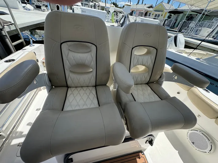  Yacht Photos Pics 2017 Sea Fox 288 Commander boat seats with beige upholstery and armrests.