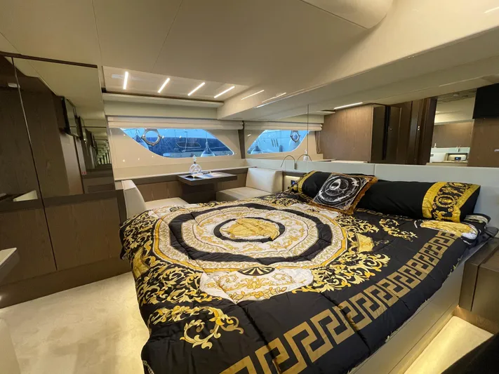  Yacht Photos Pics Luxurious bedroom interior of 2020 Ferretti Yachts 550 with elegant bedding and modern design.