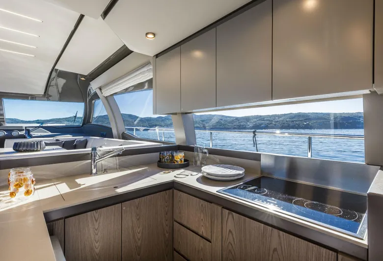  Yacht Photos Pics Modern kitchen interior of 2020 Ferretti Yachts 550 with ocean view.