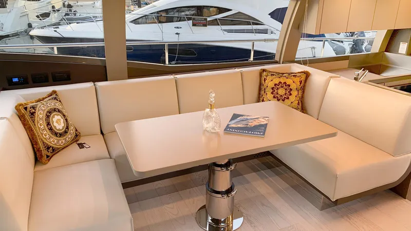  Yacht Photos Pics Luxurious interior of 2020 Ferretti Yachts 550 with elegant seating and table.