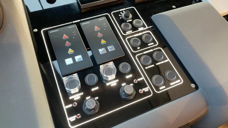  Yacht Photos Pics Control panel of a 2020 Ferretti Yachts 550, featuring various switches and buttons.
