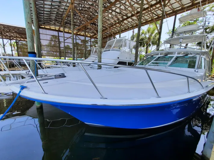 Foam O Yacht Photos Pics Cabo 45 Express 2000 in covered dock area.