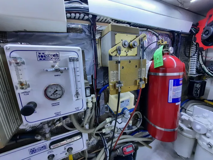 Foam O Yacht Photos Pics Engine room of 2000 Cabo 45 Express with fire extinguisher.