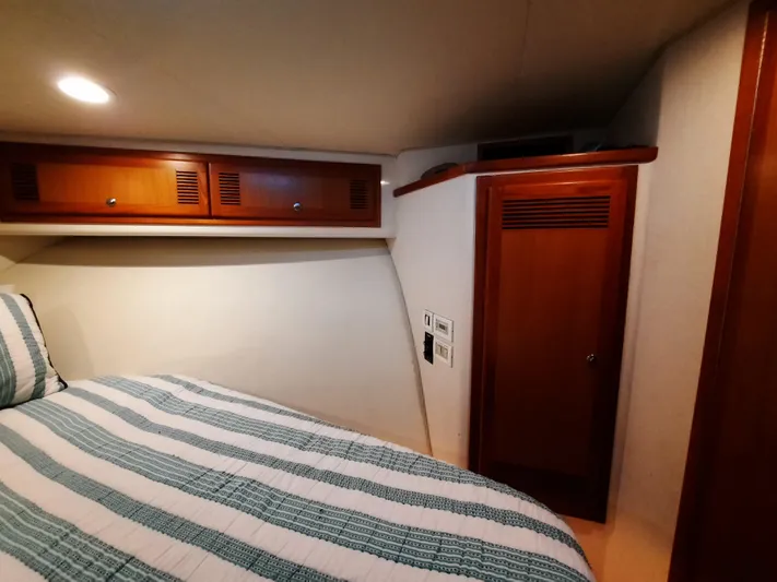 Foam O Yacht Photos Pics Interior of 2000 Cabo 45 Express with wooden cabinetry.