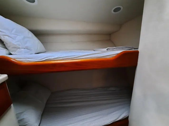 Foam O Yacht Photos Pics Interior of 2000 Cabo 45 Express with bunk beds.