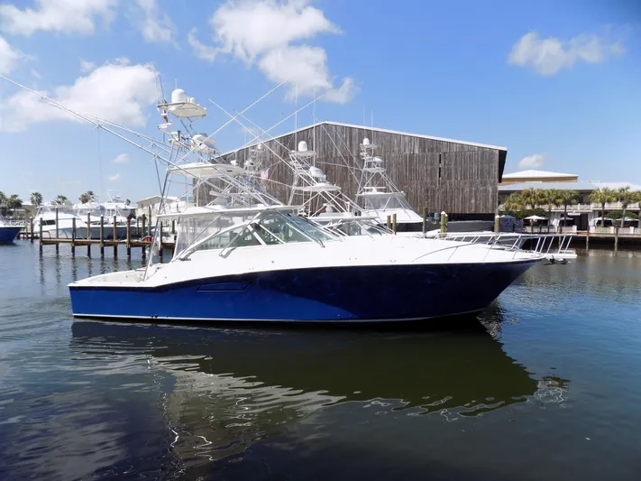 Foam O Yacht Photos Pics Cabo 45 Express 2000 yacht docked in sunny harbor.