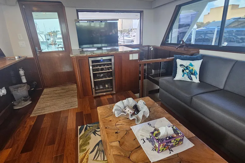 Kokomo Yacht Photos Pics Luxurious interior of 1990 Hatteras 67 Cockpit Motor Yacht with modern amenities.