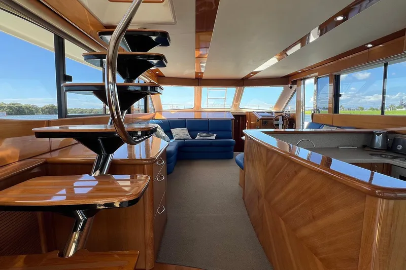 Kahala Yacht Photos Pics Luxurious interior of 2005 Maritimo M60 yacht with elegant wood finishes and modern design.