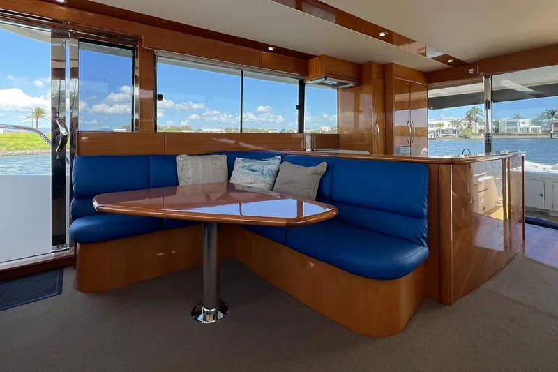 Kahala Yacht Photos Pics Luxurious 2005 Maritimo M60 yacht interior with blue seating and wooden finishes.