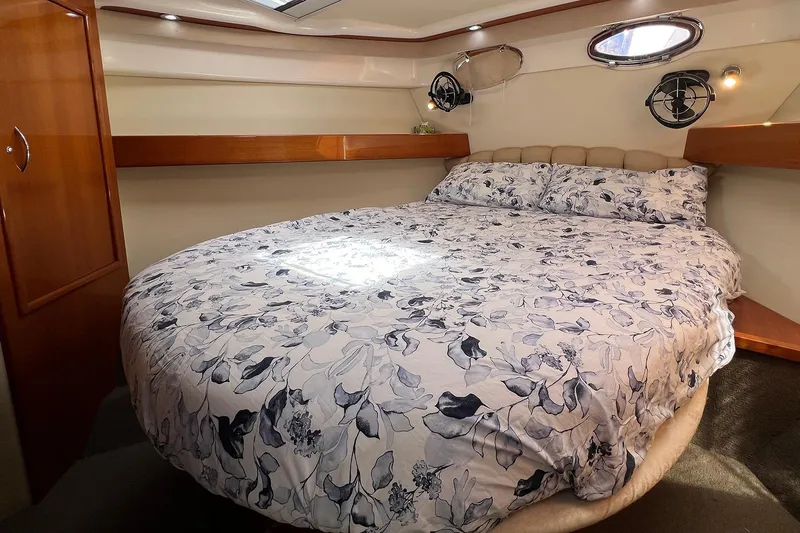 Kahala Yacht Photos Pics Luxurious bedroom interior of 2005 Maritimo M60 yacht with floral bedding.
