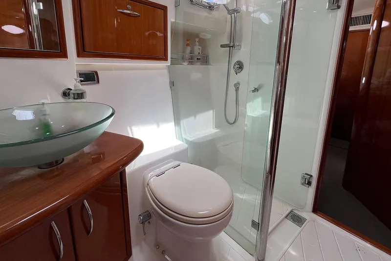 Kahala Yacht Photos Pics Luxurious bathroom in 2005 Maritimo M60 yacht with glass sink and shower.