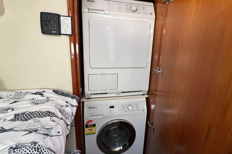 Kahala Yacht Photos Pics Laundry area in 2005 Maritimo M60 yacht with Miele washer and dryer.