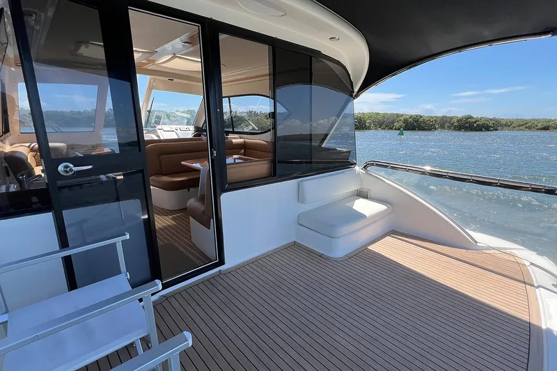 Kahala Yacht Photos Pics Luxurious 2005 Maritimo M60 yacht interior with spacious seating and scenic water view.