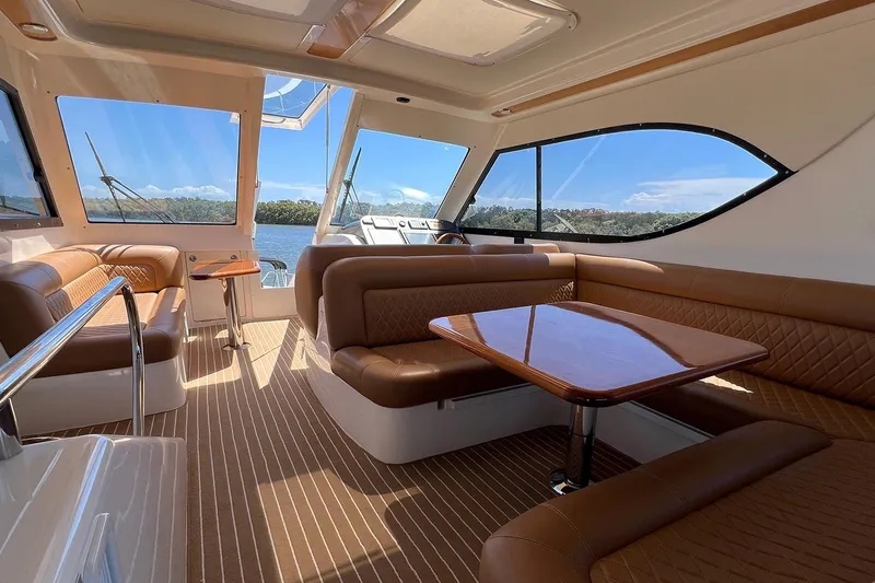 Kahala Yacht Photos Pics Luxurious interior of 2005 Maritimo M60 yacht with leather seating and panoramic windows.