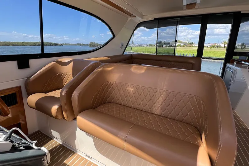 Kahala Yacht Photos Pics Luxurious interior of 2005 Maritimo M60 yacht with leather seating and scenic water view.