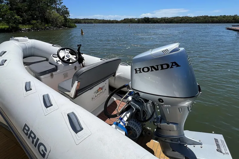Kahala Yacht Photos Pics Inflatable boat with Honda outboard motor on a calm lake, Maritimo M60, 2005.