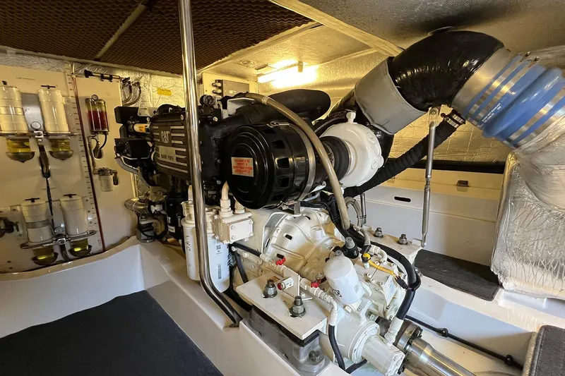 Kahala Yacht Photos Pics Engine room of a 2005 Maritimo M60 yacht, featuring a CAT marine engine.
