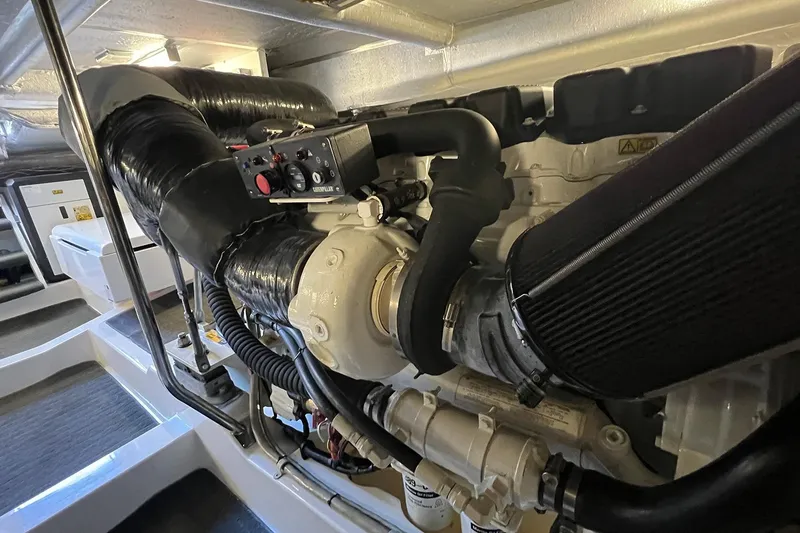 Kahala Yacht Photos Pics Engine room of 2005 Maritimo M60 yacht, showcasing detailed machinery and components.