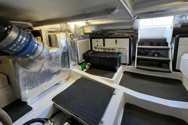 Kahala Yacht Photos Pics Engine room of 2005 Maritimo M60 yacht, featuring equipment and storage.