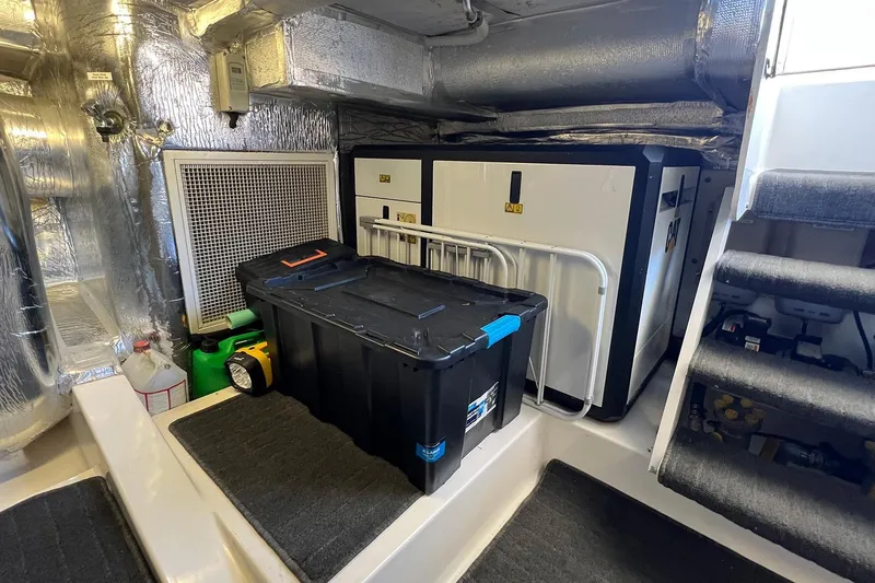 Kahala Yacht Photos Pics Engine room of 2005 Maritimo M60 yacht with equipment and storage.