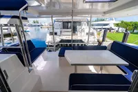 Leopard 40 catamaran interior with blue seating, table, and marina view, 2016 model.