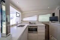 Modern kitchen interior on a 2016 Leopard 40 catamaran, featuring sleek countertops and appliances.